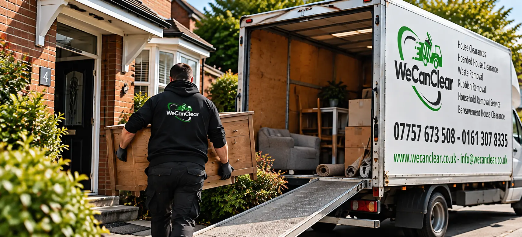 A We Can Clear worker carrying furniture out to the van during a house clearance