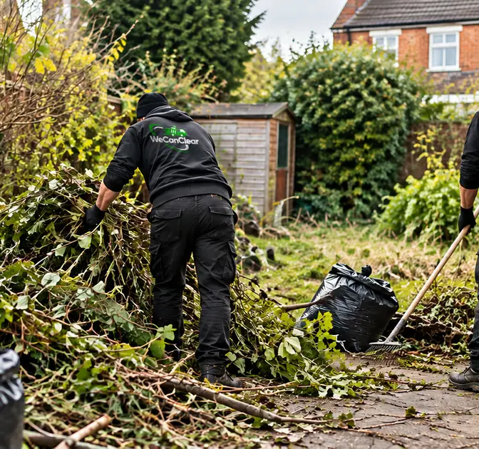 A We Can Clear worker clearing an overgrown garden